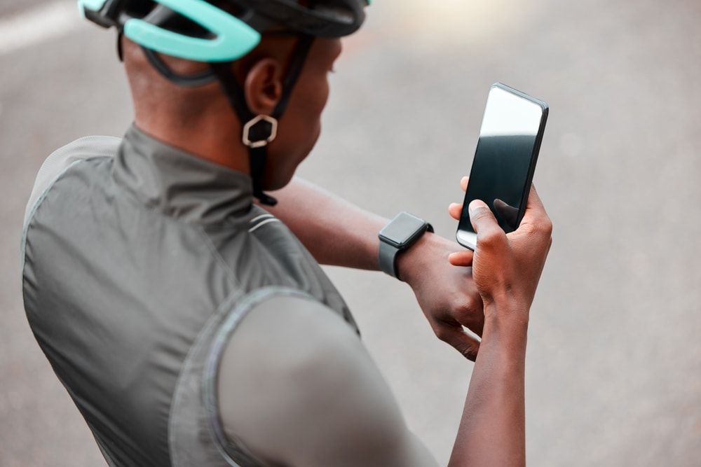 male cyclist checking mobile.jpeg