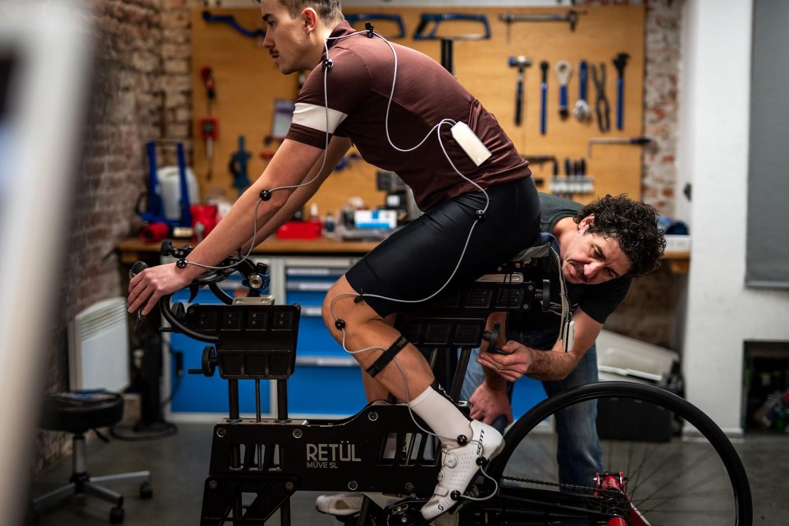 A cyclist getting a bike fitting at a bike shop