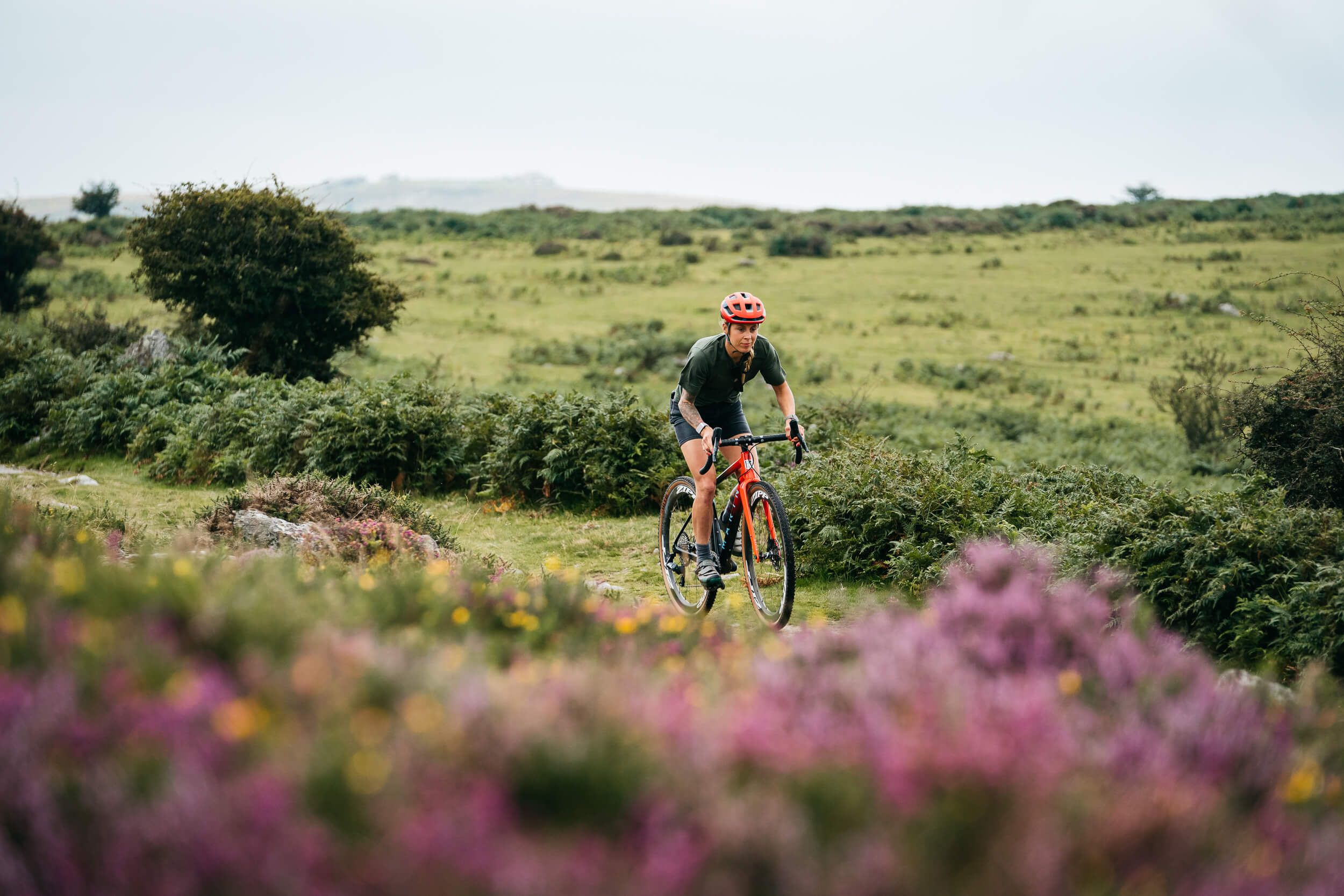 ROUVY Ambassador Juliet Elliot riding a bike on a gravel road